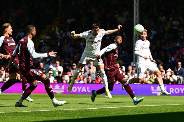 Fulham v Aston Villa, Premier League Fulham midfielder Sasa Lukic (20) heads the ball at goal under pressure from Aston Villa midfielder Lamare Bogarde (26) during the Premier League match between Fulham and Aston Villa at Craven Cottage, London, UK on 25 April 2026. London Craven Cottage Greater London UK Editorial use only DataCo restrictions apply See www.football-dataco.com , Copyright: xDennisxGoodwinx PSI-24149-0094