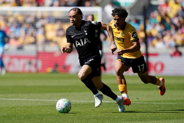 Wolverhampton, England, 25th April 2026. Xavi Simons of Tottenham (L) is challenged by Pedro Lima of Wolverhampton Wanderers during the Wolverhampton Wanderers vs Tottenham Hotspur Premier League match at Molineux, Wolverhampton. Picture credit should read: Andrew Yates Sportimage EDITORIAL USE ONLY. No use with unauthorised audio, video, data, fixture lists, club league logos or live services. Online in-match use limited to 120 images, no video emulation. No use in betting, games or single club league player publications. SPI_016_AY_WOLVES_SPURS SPI-4731-0016