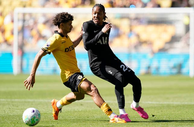 Wolverhampton, England, 25th April 2026.Djed Spence of Tottenham (R) is challenged by Pedro Lima of Wolverhampton Wanderers during the Wolverhampton Wanderers vs Tottenham Hotspur Premier League match at Molineux, Wolverhampton. Picture credit should read: Andrew Yates Sportimage EDITORIAL USE ONLY. No use with unauthorised audio, video, data, fixture lists, club league logos or live services. Online in-match use limited to 120 images, no video emulation. No use in betting, games or single club league player publications. SPI_019_AY_WOLVES_SPURS SPI-4731-0019