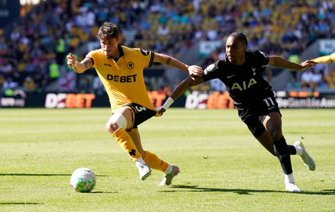 Wolverhampton, England, 25th April 2026.Hugo Bueno of Wolverhampton Wanderers (L) is challenged by Mathys Tel of Tottenham during the Wolverhampton Wanderers vs Tottenham Hotspur Premier League match at Molineux, Wolverhampton. Picture credit should read: Andrew Yates Sportimage EDITORIAL USE ONLY. No use with unauthorised audio, video, data, fixture lists, club league logos or live services. Online in-match use limited to 120 images, no video emulation. No use in betting, games or single club league player publications. SPI_020_AY_WOLVES_SPURS SPI-4731-0020