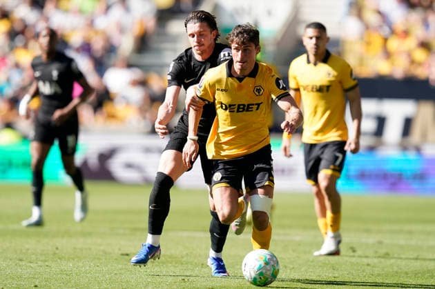 Wolverhampton, England, 25th April 2026. Hugo Bueno of Wolverhampton Wanderers (R) is challenged by Conor Gallagher of Tottenham during the Wolverhampton Wanderers vs Tottenham Hotspur Premier League match at Molineux, Wolverhampton. Picture credit should read: Andrew Yates Sportimage EDITORIAL USE ONLY. No use with unauthorised audio, video, data, fixture lists, club league logos or live services. Online in-match use limited to 120 images, no video emulation. No use in betting, games or single club league player publications. SPI_022_AY_WOLVES_SPURS SPI-4731-0022