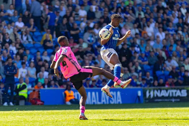 Cardiff City v Northampton Town, EFL Sky Bet League 1 Northampton Town central midfielder Tyrese Fornah (14) competes for a high ball with Cardiff City defender Ronan Kpakio (44) during the EFL Sky Bet League 1 match between Cardiff City and Northampton Town at the Cardiff City Stadium, Cardiff, UK on 25 April 2026. Cardiff Cardiff City Stadium South Glamorgan UK Editorial use only DataCo restrictions apply See www.football-dataco.com , Copyright: xDanxMintox PSI-24150-0009