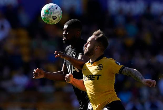Wolverhampton, England, 25th April 2026. Kevin Danso of Tottenham (L) is challenged by Adam Armstrong of Wolverhampton Wanderers during the Wolverhampton Wanderers vs Tottenham Hotspur Premier League match at Molineux, Wolverhampton. Picture credit should read: Andrew Yates Sportimage EDITORIAL USE ONLY. No use with unauthorised audio, video, data, fixture lists, club league logos or live services. Online in-match use limited to 120 images, no video emulation. No use in betting, games or single club league player publications. SPI_036_AY_WOLVES_SPURS SPI-4731-0035