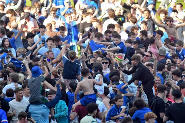 Football - 2025 2026 EFL Sky Bet League One - Cardiff City vs. Northampton Town - Cardiff City Stadium - Saturday 24th April 2026 pITCH INVASION BY CARDIFF FANS HOLDS UP PRESENTATION Pic- COLORSPORT Winston Bynorth 