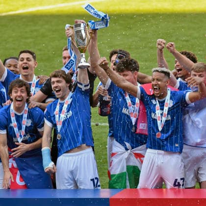 Football - 2025 2026 EFL Sky Bet League One - Cardiff City vs. Northampton Town - Cardiff City Stadium - Saturday 24th April 2026 Rubin Colwill, CAPT, CARDIFF CITY RAISES THE TROPHY AS cARDIFF CELEBRATE PROMOTION Pic- COLORSPORT Winston Bynorth 