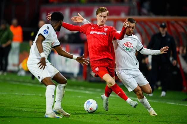 ENSCHEDE , 25-04-2026 , Stadium Grolsch Veste , season 2025 2026 , Dutch Eredivisie football , match between FC Twente and NEC Nijmegen , picture shows NEC Nijmegen player Eli Dasa FC Twente player Mats Rots NEC Nijmegen player Darko Nejasmic Twente - NEC  x203293195x Copyright: