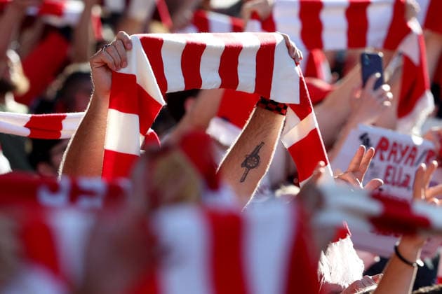 Arsenal v Newcastle United 25 April 2026 London - Premier League Football - Arsenal v Newcastle United - a fan with a canon tattoo holds a scarf aloft at the Emirates Stadium - (Photo by Mark Leech). London UK Copyright: xMarkxLeechxOffside