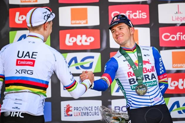 Slovenian Tadej Pogacar of UAE Team Emirates-XRG and Belgian Remco Evenepoel of Red Bull-BORA-hansgrohe pictured on the podium after the men elite race of the Liege-Bastogne-Liege UCI World Tour one day cycling race, 259,5km from Liege, over Bastogne to Liege, Sunday 26 April 2026. MAARTENxSTRAETEMANS  x172091136x