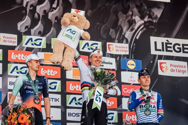 2026 Liege-Bastogne-Liege Picture by Zac Williams SWpix.com - 26 04 2026 - Cycling - 2026 Liege-Bastogne-Liege - podium - Tadej Pogacar celebrates his win, Paul Seixas and Remco Evenepoel Copyright: x xSWpix.comx(t axPhotographyxHubxLtd)xZacxWilliams SWpix.comx SWP-2645