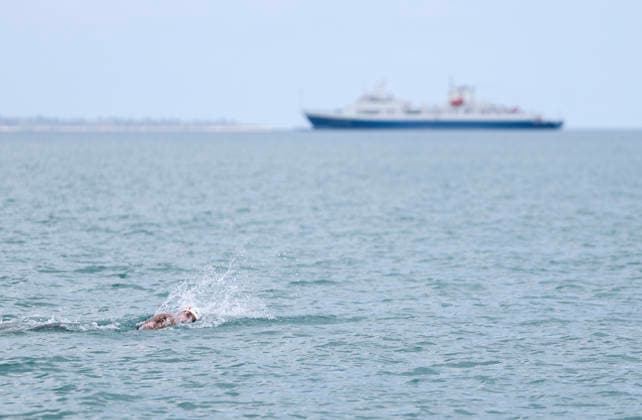 (260427) -- SANYA, April 27, 2026 -- Zhang Ziyang of team China competes during the open water swimming mixed 4x1.5km Relay at the 6th Asian Beach Games in Sanya, south China s Hainan Province, April 27, 2026. (Photo by Xinhua) (SP)CHINA-HAINAN-SANYA-ASIAN BEACH GAMES-OPEN WATER SWIMMING (CN) MaxZihan 