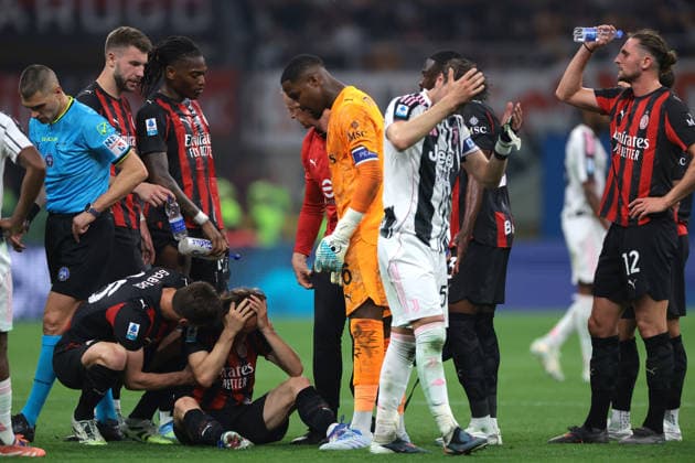 Milan, Italy, 26th April 2026. Luka Modric of AC Milan and Manuel Locatelli of Juventus receive treatment following a clash of heads during the AC Milan vs Juventus Serie A match at Giuseppe Meazza, Milan. Picture credit should read: Jonathan Moscrop Sportimage EDITORIAL USE ONLY. No use with unauthorised audio, video, data, fixture lists, club league logos or live services. Online in-match use limited to 120 images, no video emulation. No use in betting, games or single club league player publications. SPI_095_JM_MILAN_JUVE SPI-4695-0095
