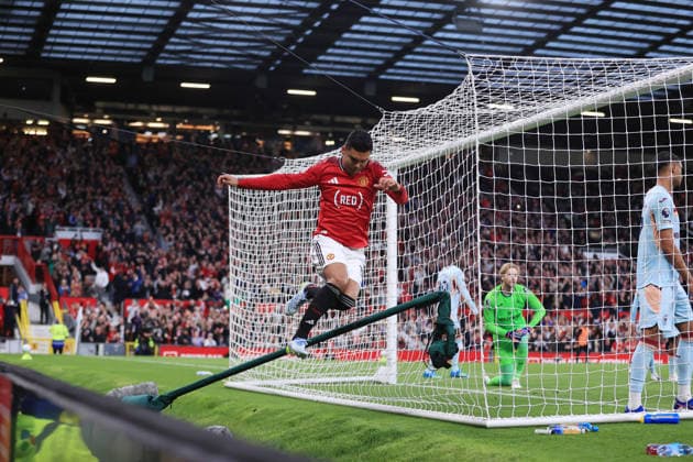 Football - Premier League - Manchester United, ManU v Brentford 27th April 2026 - Premier League - Manchester United v Brentford - Casemiro of Manchester United jumps over a goal net camera as he celebrates after scoring their 1st goal - Photo: Simon Stacpoole Offside. Manchester UK Copyright: xSimonxStacpoolexOffside