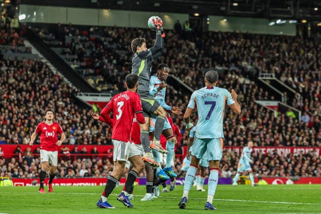 Premier League: Manchester United, ManU v Brentford Manchester United goalkeeper Senne Lammens jumps up to win the high ball during the Premier League match Manchester United vs Brentford at Old Trafford, Manchester, United Kingdom on 27 April 2026 (Photo by Mark Cosgrove News Images) Manchester Old Trafford Greater Manchester United Kingdom Copyright: xMarkxCosgrove NewsxImagesx