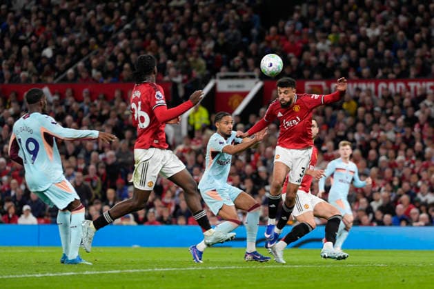 27th April 2026; Old Trafford, Manchester, England; Premier League Football, Manchester United, ManU versus Brentford; Noussair Mazraoui of Manchester United wins a header StevexFlynn