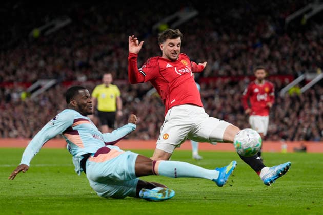 27th April 2026; Old Trafford, Manchester, England; Premier League Football, Manchester United, ManU versus Brentford; Dango Ouattara of Brentford crosses the ball under pressure from Mason Mount of Manchester United StevexFlynn