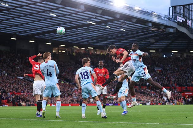 Football - Premier League - Manchester United, ManU v Brentford 27th April 2026 - Premier League - Manchester United v Brentford - Harry Maguire of Manchester United beats Michael Kayode of Brentford to a header - Photo: Simon Stacpoole Offside. Manchester UK Copyright: xSimonxStacpoolexOffside