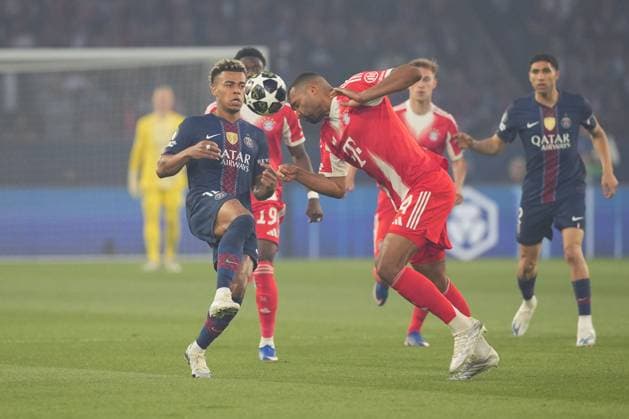 Jonathan Tah of Bayern Munich clears from Desire Doue of PSG Paris Saint-Germain v Bayern Munich, UEFA Champions League, Semi Final, First Leg, Football, Parc des Princes, Paris, France - 28 Apr 2026Paris Parc des Princes France EDITORIAL USE ONLY No use with unauthorised audio, video, data, fixture lists, club league logos or live services. Online in-match use limited to 120 images, no video emulation. No use in betting, games or single club league player publications. Copyright: xDavexWinter Shutterstockx 16847969y