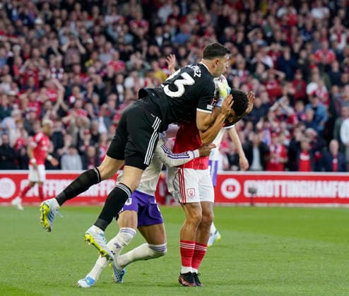 Nottingham, England, 30th April 2026. Emiliano Martinez of Aston Villa clatters into Morgan Gibbs White of Nottingham Forest during the Nottingham Forest vs Aston Villa UEFA Europa League Semi Final 1st leg match at the City Ground, Nottingham. Picture credit should read: Andrew Yates Sportimage EDITORIAL USE ONLY. No use with unauthorised audio, video, data, fixture lists, club league logos or live services. Online in-match use limited to 120 images, no video emulation. No use in betting, games or single club league player publications. SPI_035_AY_Forest_Villa SPI-4767-0035