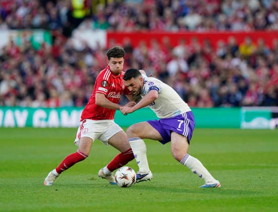 Nottingham, England, 30th April 2026. Neco Williams of Nottingham Forest (l) tussles with John McGinn of Aston Villa (r) during the Nottingham Forest vs Aston Villa UEFA Europa League Semi Final 1st leg match at the City Ground, Nottingham. Picture credit should read: Andrew Yates Sportimage EDITORIAL USE ONLY. No use with unauthorised audio, video, data, fixture lists, club league logos or live services. Online in-match use limited to 120 images, no video emulation. No use in betting, games or single club league player publications. SPI_037_AY_Forest_Villa SPI-4767-0037