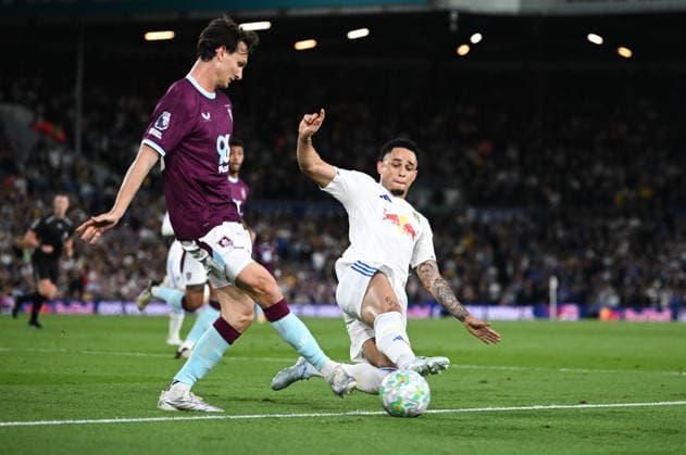 Leeds, England, 1st May 2026. Noah Okafor of Leeds United lunges for the ball against Hjalmar Ekdal of Burnley during the Leeds United vs Burnley Premier League match at Elland Road, Leeds. Picture credit should read: Harriet Massey Sportimage EDITORIAL USE ONLY. No use with unauthorised audio, video, data, fixture lists, club league logos or live services. Online in-match use limited to 120 images, no video emulation. No use in betting, games or single club league player publications. SPI_056_LEEDS_v_BURNLEY SPI-4768-0056