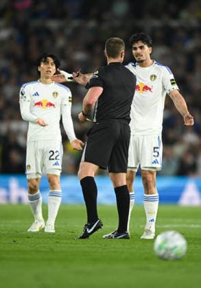 Leeds, England, 1st May 2026. Pascal Struijk of Leeds United challenges referee Thomas Bramall during the Leeds United vs Burnley Premier League match at Elland Road, Leeds. Picture credit should read: Harriet Massey Sportimage EDITORIAL USE ONLY. No use with unauthorised audio, video, data, fixture lists, club league logos or live services. Online in-match use limited to 120 images, no video emulation. No use in betting, games or single club league player publications. SPI_057_LEEDS_v_BURNLEY SPI-4768-0057
