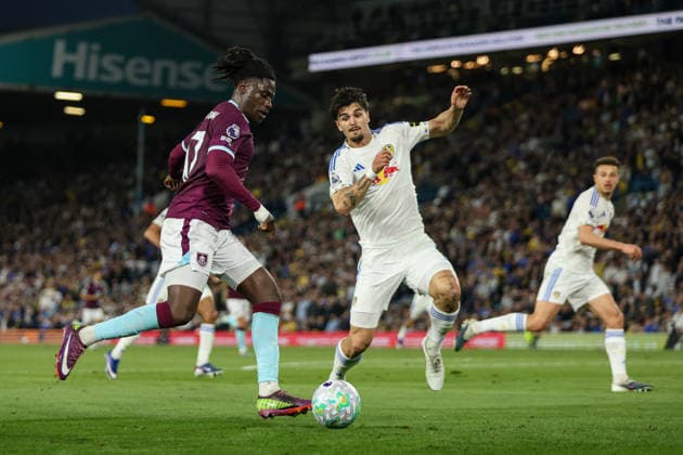 1st May 2026; Elland Road, Leeds, Yorkshire, England; Premier League Football, Leeds United versus Burnley; Loum Tchaouna of Burnley looks to deliver a cross whilst Pascal Struijk of Leeds United closes him down AidanxHunter