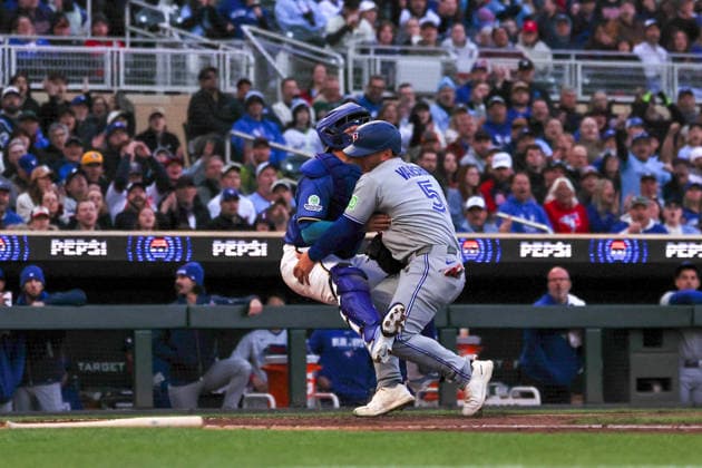May 1st, 2026: Toronto Blue Jays center fielder Daulton Varsho (5) collides with Minnesota Twins catcher Victor Caratini (37) on the way to home plate. Varsho scored on a throwing error in the second inning during the game between the Toronto Blue Jays and the Minnesota Twins at Target Field in Minneapolis, Minnesota. CSM Minneapolis USA - ZUMAc04_ 20260501_zma_c04_045 Copyright: xStevenxGarciax