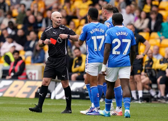 Wolverhampton, England, 2nd May 2026. Referee Paul Tierney show a red card to Daniel Ballard of Sunderland goal during the Wolverhampton Wanderers vs Sunderland Premier League match at Molineux, Wolverhampton. Picture credit should read: Andrew Yates Sportimage EDITORIAL USE ONLY. No use with unauthorised audio, video, data, fixture lists, club league logos or live services. Online in-match use limited to 120 images, no video emulation. No use in betting, games or single club league player publications. SPI_019_AY_WOLVES_SUNDERLAND SPI-4772-0018