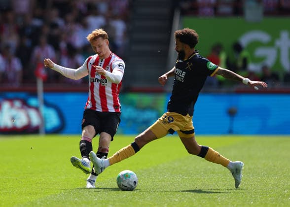 2nd May 2026; Gtech Community Stadium, Brentford, London, England; Premier League Football, Brentford versus West Ham United; Sepp van den Berg of Brentford under pressure from Pablo of West Ham United JPxFletcher