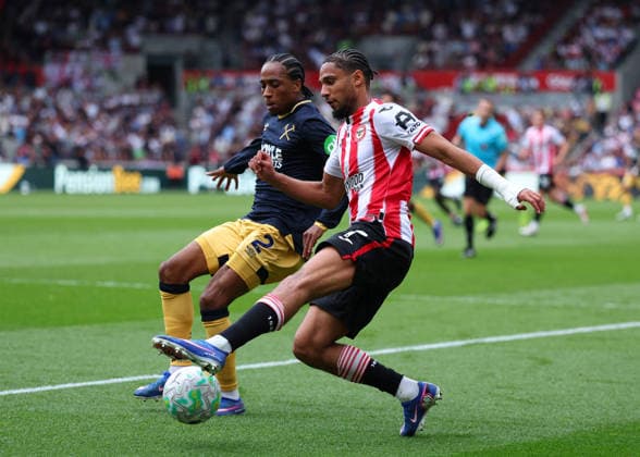 2nd May 2026; Gtech Community Stadium, Brentford, London, England; Premier League Football, Brentford versus West Ham United; Kevin Schade of Brentford under pressure from Kyle Walker-Peters of West Ham United JPxFletcher