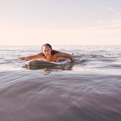 Surfing, woman and portrait in waves, sea and ocean for summer adventure, freedom and sky mockup in Australia. Female surfer, board and swimming in water, beach and relax for tropical holiday travel. (License=RF) 19821169 ,model released, Symbolfoto  Copyright: xZoonar.com YurixArcursxpeopleimages.comx 19821169 ,model released, Symbolfoto ,property released