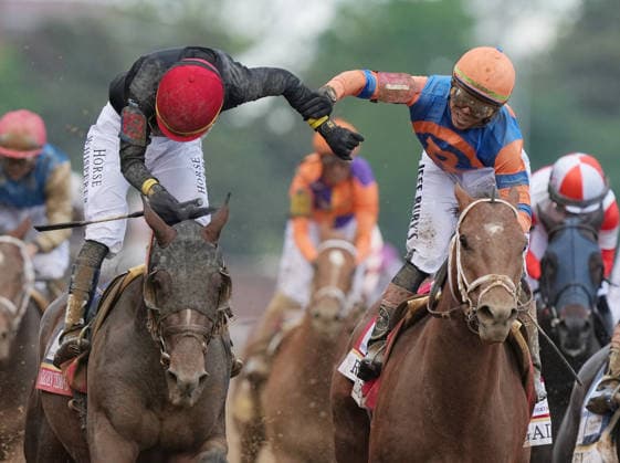 Jockey Jose Ortiz riding Golden Tempo (L) is congratulated by his brother Irad Ortiz Jr. on Renegade as he wins the 152nd running of the Kentucky Derby at Churchill Downs on Saturday, May 2, 2026, in Louisville, Kentucky. Renegade finished second and 70-1 long shot Ocelli ridden by jockey Joseph Ramos placed third.  KYP20260502910 PATxBENIC