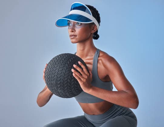 Do it for those gorgeous glutes. Studio shot of a fit young woman working out with a medicine ball against a grey background (License=RF) 19828759 ,model released, Symbolfoto  Copyright: xZoonar.com YurixArcursxpeopleimages.comx 19828759 ,model released, Symbolfoto ,property released