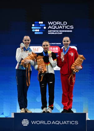 (260503) -- XI AN, May 3, 2026 -- Gold medalist Klara Bleyer (C) of Germany, silver medalist Vasilina Khandoshka (L) of Belarus and bronze medalist Ekaterina Shtatnova of Russia pose with medals during the awarding ceremony after the women solo free event at the World Aquatics Artistic Swimming World Cup 2026-Stop 3 in Xi an, northwest China s Shaanxi Province, May 3, 2026. ) (SP)CHINA-XI AN-ARTISTIC SWIMMING-WORLD CUP-WOMEN SOLO FREE (CN) ZouxJingyi 
