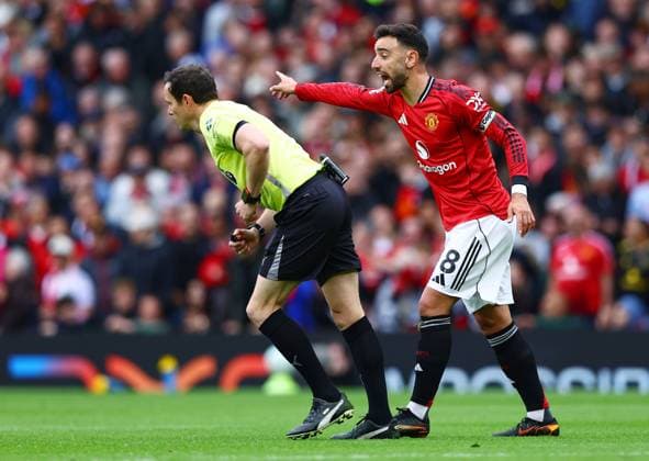 Bruno Fernandes of Manchester United, ManU and referee Darren England Manchester United v Liverpool, Premier League, Football, Old Trafford, Manchester , UK - 03 May 2026Manchester Old Trafford United Kingdom EDITORIAL USE ONLY No use with unauthorised audio, video, data, fixture lists, club league logos or live services. Online in-match use limited to 120 images, no video emulation. No use in betting, games or single club league player publications. Copyright: xMattxWest Shutterstockx 16854589s