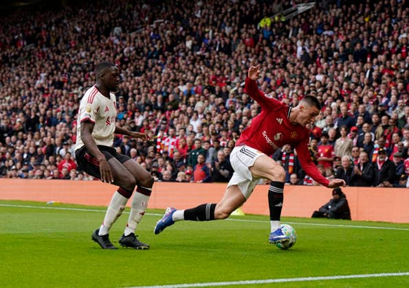 Manchester, England, 3rd May 2026. Benjamin Sesko of Manchester United, ManU gets shoved in the back by Ibrahima Konate of Liverpool (l) and slides off the pitch during the Manchester United vs Liverpool Premier League match at Old Trafford, Manchester. Picture credit should read: Andrew Yates Sportimage EDITORIAL USE ONLY. No use with unauthorised audio, video, data, fixture lists, club league logos or live services. Online in-match use limited to 120 images, no video emulation. No use in betting, games or single club league player publications. SPI_054_AY_MAN_UTD_LIVERPOOL SPI-4776-0049