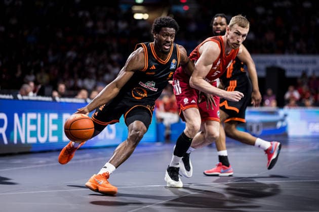 MUNICH, GERMANY - MAY 03: TJ Bamba (Rasta Vechta, 5) controls the ball against Niels Giffey (FC Bayern Muenchen, 5) during the easyCredit Basketball Bundesliga match between FC Bayern Muenchen vs. Rasta Vechta at BMW Park on matchday 32 of the easyCredit Basketball Bundesliga on May 03, 2026 in Munich, Germany. Bavaria Germany Copyright: xSteffiexWunderlx