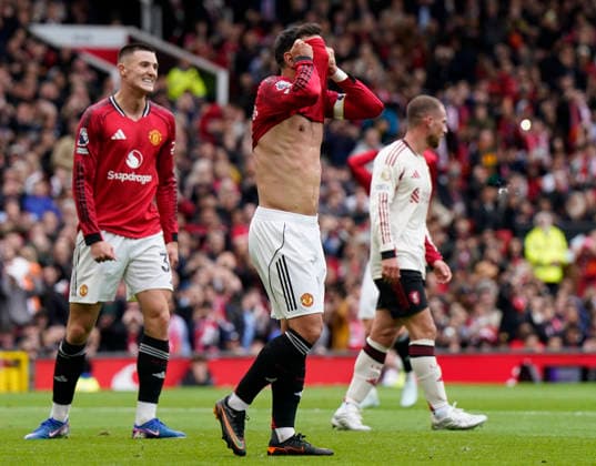 Manchester, England, 3rd May 2026. Bruno Fernandes of Manchester United, ManU reacts following a missed chance during the Manchester United vs Liverpool Premier League match at Old Trafford, Manchester. Picture credit should read: Andrew Yates Sportimage EDITORIAL USE ONLY. No use with unauthorised audio, video, data, fixture lists, club league logos or live services. Online in-match use limited to 120 images, no video emulation. No use in betting, games or single club league player publications. SPI_063_AY_MAN_UTD_LIVERPOOL SPI-4776-0062