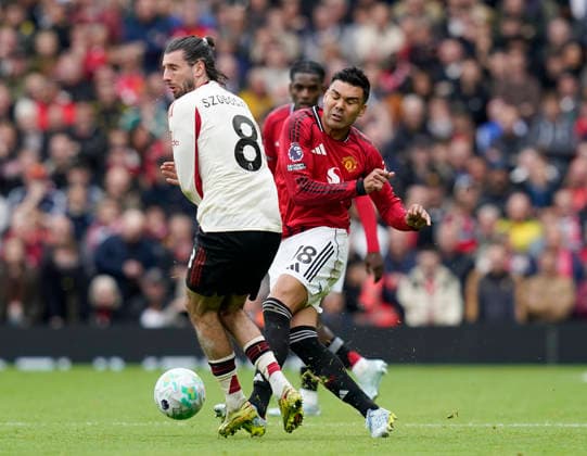 Manchester, England, 3rd May 2026. Dominik Szoboszlai of Liverpool and Casemiro of Manchester United, ManU during the Manchester United vs Liverpool Premier League match at Old Trafford, Manchester. Picture credit should read: Andrew Yates Sportimage EDITORIAL USE ONLY. No use with unauthorised audio, video, data, fixture lists, club league logos or live services. Online in-match use limited to 120 images, no video emulation. No use in betting, games or single club league player publications. SPI_068_AY_MAN_UTD_LIVERPOOL SPI-4776-0066