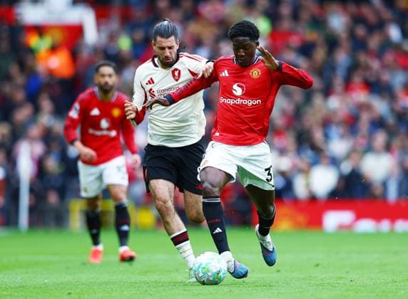 Kobbie Mainoo of Manchester United, ManU and Dominik Szoboszlai of Liverpool Manchester United v Liverpool, Premier League, Football, Old Trafford, Manchester , UK - 03 May 2026Manchester Old Trafford United Kingdom EDITORIAL USE ONLY No use with unauthorised audio, video, data, fixture lists, club league logos or live services. Online in-match use limited to 120 images, no video emulation. No use in betting, games or single club league player publications.  Copyright: xMattxWest Shutterstockx 16854589y