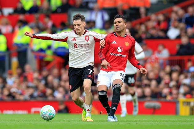 Manchester United, ManU v Liverpool, Premier League Casemiro (18) of Manchester United passes the ball under pressure from Florian Wirtz (7) of Liverpool during the Premier League match between Manchester United and Liverpool at Old Trafford, Manchester, UK on 3 May 2026. Manchester Old Trafford Greater Manchester UK Editorial use only DataCo restrictions apply See www.football-dataco.com , Copyright: xConorxMolloyx PSI-24192-0061