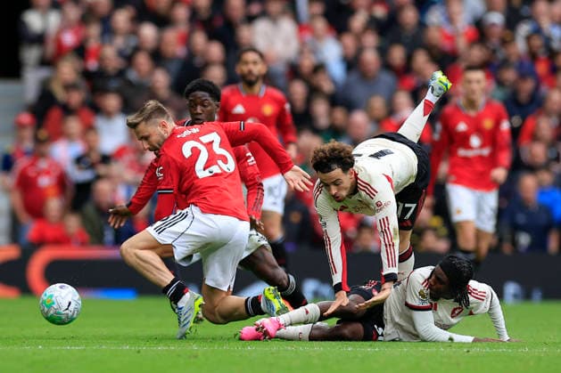 Manchester United, ManU v Liverpool, Premier League Luke Shaw (23) of Manchester United escapes with the ball under pressure from Curtis Jones (17) and Jeremie Frimpong (30) of Liverpool during the Premier League match between Manchester United and Liverpool at Old Trafford, Manchester, UK on 3 May 2026. Manchester Old Trafford Greater Manchester UK Editorial use only DataCo restrictions apply See www.football-dataco.com , Copyright: xConorxMolloyx PSI-24192-0063