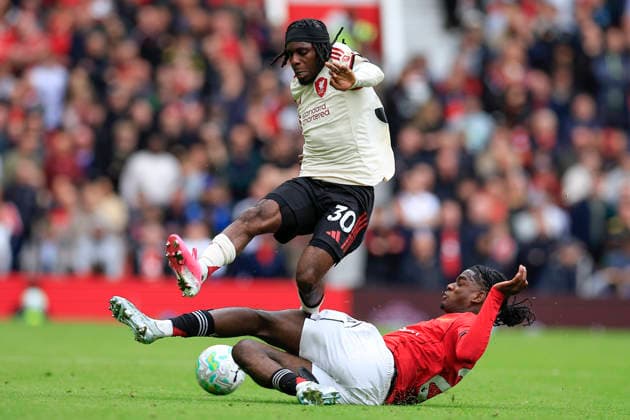 Manchester United, ManU v Liverpool, Premier League Jeremie Frimpong (30) of Liverpool is challenged by Ayden Heaven (26) of Manchester United during the Premier League match between Manchester United and Liverpool at Old Trafford, Manchester, UK on 3 May 2026. Manchester Old Trafford Greater Manchester UK Editorial use only DataCo restrictions apply See www.football-dataco.com , Copyright: xConorxMolloyx PSI-24192-0068