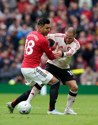 Manchester, England, 3rd May 2026. Casemiro of Manchester United, ManU tussles with Alexis Mac Allister of Liverpool during the Manchester United vs Liverpool Premier League match at Old Trafford, Manchester. Picture credit should read: Andrew Yates Sportimage EDITORIAL USE ONLY. No use with unauthorised audio, video, data, fixture lists, club league logos or live services. Online in-match use limited to 120 images, no video emulation. No use in betting, games or single club league player publications. SPI_075_AY_MAN_UTD_LIVERPOOL SPI-4776-0074
