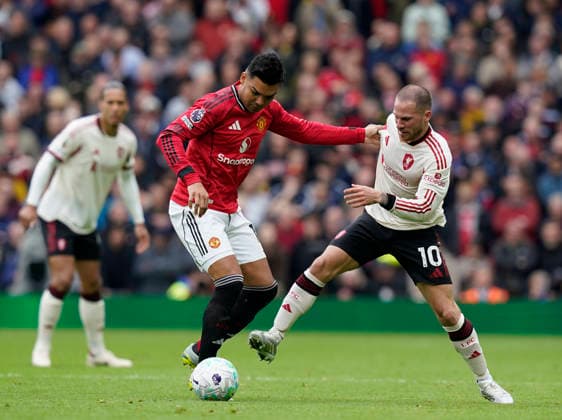 Manchester, England, 3rd May 2026. Casemiro of Manchester United, ManU tussles with Alexis Mac Allister of Liverpool during the Manchester United vs Liverpool Premier League match at Old Trafford, Manchester. Picture credit should read: Andrew Yates Sportimage EDITORIAL USE ONLY. No use with unauthorised audio, video, data, fixture lists, club league logos or live services. Online in-match use limited to 120 images, no video emulation. No use in betting, games or single club league player publications. SPI_076_AY_MAN_UTD_LIVERPOOL SPI-4776-0075
