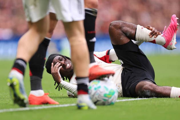 Football - Premier League - Manchester United, ManU v Liverpool 3rd May 2026 - Premier League - Manchester United v Liverpool - Jeremie Frimpong of Liverpool goes down injured - Photo: Simon Stacpoole Offside. Manchester UK Copyright: xSimonxStacpoolexOffside