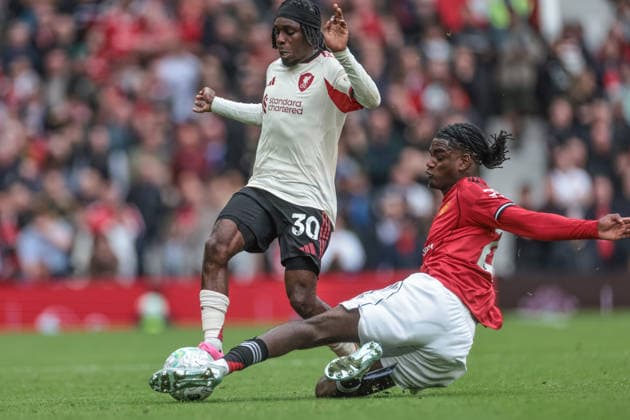 Manchester United, ManU v Liverpool - Premier League Ayden Heaven of Manchester United slide tackles Jeremie Frimpong of Liverpool during the Premier League match between Manchester United and Liverpool at Old Trafford, Manchester, United Kingdom, on May 3, 2026. Manchester Greater Manchester United Kingdom  Copyright: xNewsxImagesx originalFilename:cosgrove-premierl260503_npvjP.jpg