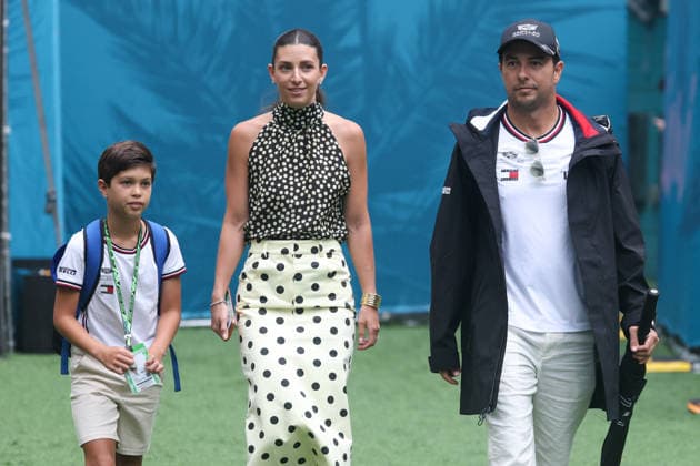 3rd May 2026; Miami International Autodrome, Miami, Florida, United States of America; 2026 FIA Formula 1 Miami Grand Prix Race Day; Sergio Perez (11) of Mexico and Cadillac Formula 1 Team enters team village with his wife Carola Martínez and son Sergio Jr. DavidxBuono