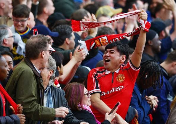 A Manchester United, ManU fan celebrates Manchester United v Liverpool, Premier League, Football, Old Trafford, Manchester , UK - 03 May 2026Manchester Old Trafford United Kingdom EDITORIAL USE ONLY No use with unauthorised audio, video, data, fixture lists, club league logos or live services. Online in-match use limited to 120 images, no video emulation. No use in betting, games or single club league player publications. Copyright: xMattxWest Shutterstockx 16854589an