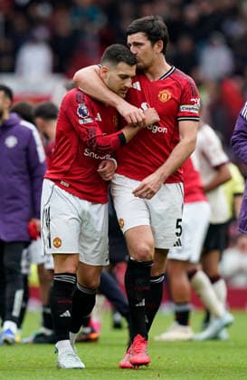 Manchester, England, 3rd May 2026. Diogo Dalot of Manchester United, ManU and Harry Maguire of Manchester United celebrate the win during the Manchester United vs Liverpool Premier League match at Old Trafford, Manchester. Picture credit should read: Andrew Yates Sportimage EDITORIAL USE ONLY. No use with unauthorised audio, video, data, fixture lists, club league logos or live services. Online in-match use limited to 120 images, no video emulation. No use in betting, games or single club league player publications. SPI_113_AY_MAN_UTD_LIVERPOOL SPI-4776-0110